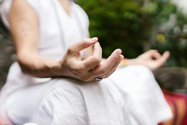 Close up of hands in mudra during meditation session